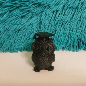 3D-printed owl figurine wearing a graduation cap